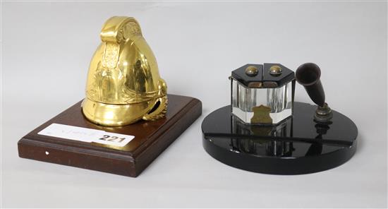 A novelty helmet inkwell and a black glass inkwell